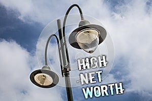 Text sign showing High Net Worth. Conceptual photo having high-value Something expensive A-class company Double Light post sky enl