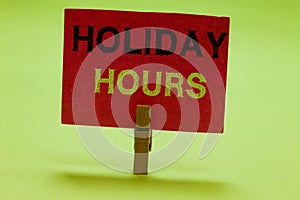 Text sign showing Holiday Hours. Conceptual photo Schedule 24 or 7 Half Day Today Last Minute Late Closing Clothespin