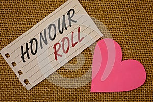 Text sign showing Honour Roll. Conceptual photos List of students who have earned grades above a specific averageNotebook page Wic