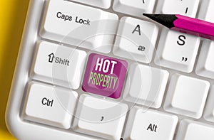 Text sign showing Hot Property. Conceptual photo Something which is sought after or is Heavily Demanded Different