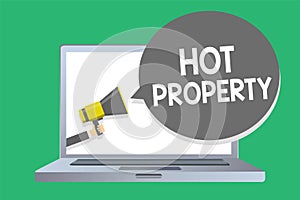 Text sign showing Hot Property. Conceptual photo Something which is sought after or is Heavily Demanded Man holding megaphone loud