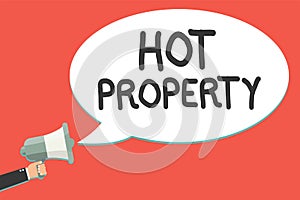 Text sign showing Hot Property. Conceptual photo Something which is sought after or is Heavily Demanded Man holding megaphone loud