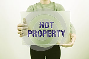 Text sign showing Hot Property. Word Written on Something which is sought after or is Heavily Demanded