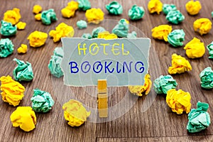 Text sign showing Hotel Booking. Conceptual photo Online Reservations Presidential Suite De Luxe Hospitality Clothespin holding gr photo