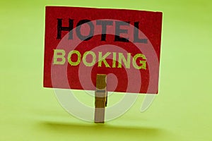 Text sign showing Hotel Booking. Conceptual photo Online Reservations Presidential Suite De Luxe Hospitality Clothespin photo