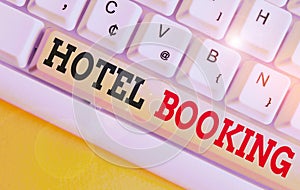 Text sign showing Hotel Booking. Conceptual photo Online Reservations Presidential Suite De Luxe Hospitality White pc keyboard photo