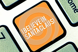 Text sign showing I Believe In Santa Claus. Conceptual photo To have faith in Christmas Holiday childhood Keyboard key