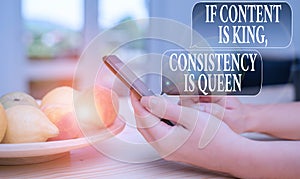 Text sign showing If Content Is King Consistency Is Queen. Conceptual photo Marketing strategies Persuasion woman using