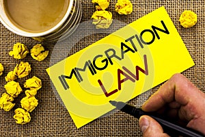 Text sign showing Immigration Law. Conceptual photo National Regulations for immigrants Deportation rules written on Sticky Note P