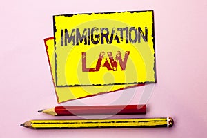 Text sign showing Immigration Law. Conceptual photo National Regulations for immigrants Deportation rules written on Yellow Sticky