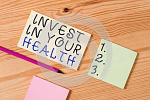 Text sign showing Invest In Your Health. Conceptual photo put money on maintenance or improvement of your health Colored