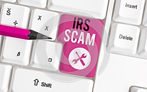 Text sign showing Irs Scam. Conceptual photo targeted taxpayers by pretending to be Internal Revenue Service White pc