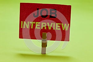 Text sign showing Job Interview. Conceptual photo Assessment Questions Answers Hiring Employment Panel Clothespin holding red pape