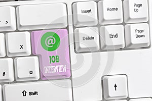 Text sign showing Job Interview. Conceptual photo Assessment Questions Answers Hiring Employment Panel White pc keyboard