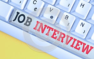 Text sign showing Job Interview. Conceptual photo Assessment Questions Answers Hiring Employment Panel White pc keyboard