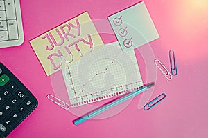 Text sign showing Jury Duty. Conceptual photo obligation or a period of acting as a member of a jury in court Stationary and note