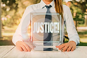 Text sign showing Justice. Conceptual photo impartial adjustment of conflicting claims or assignments Female business