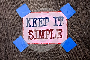 Text sign showing Keep It Simple. Conceptual photo Simplify Things Easy Understandable Clear Concise Ideas written on Pink Sticky