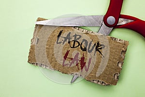 Text sign showing Labour Law. Conceptual photo Employment Rules Worker Rights Obligations Legislation Union written on Tear Cardbo