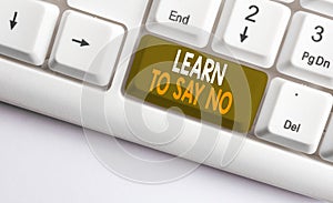 Text sign showing Learn To Say No. Conceptual photo decline or refuse few things before you destroy yourself White pc keyboard