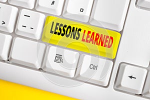 Text sign showing Lessons Learned. Conceptual photo the knowledge or understanding gained by experience White pc