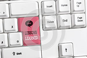 Text sign showing Lessons Learned. Conceptual photo the knowledge or understanding gained by experience White pc