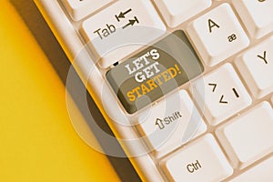 Text sign showing Let S Is Get Started. Conceptual photo to begin doing or working on something you had started White pc keyboard