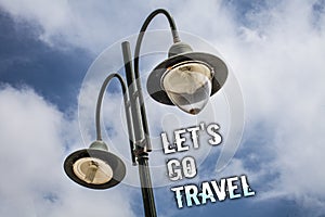 Text sign showing Let 'S Go Travel. Conceptual photo Going away Travelling Asking someone to go outside Trip Double Light post sky