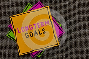 Text sign showing Longterm Goals. Conceptual photo Strategic target that is required more time for completion Paper notes Importan