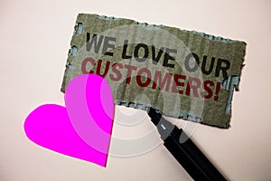 Text sign showing We Love Our Customers Call. Conceptual photo Client deserves good service satisfaction respect Brown paperboard