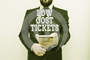 Text sign showing Low Cost Tickets. Conceptual photo small paper bought to provide access to service or show Male human