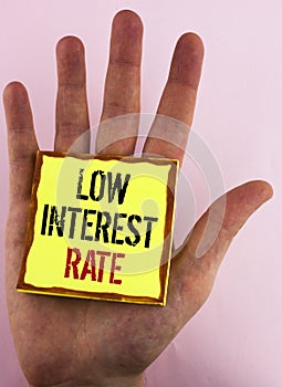 Text sign showing Low Interest Rate. Conceptual photo Manage money wisely pay lesser rates save higher written on Yellow Sticky No