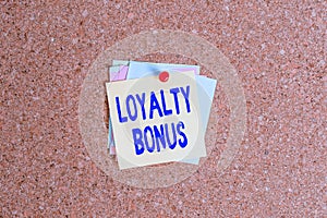 Text sign showing Loyalty Bonus. Conceptual photo reward such as money or points is given for a loyal customer Corkboard color