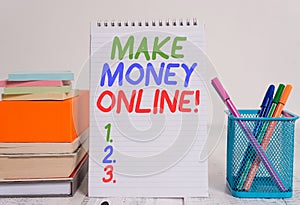 Text sign showing Make Money Online. Conceptual photo making profit using internet like freelancing or marketing Pens metal holder