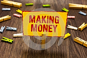 Text sign showing Making Money. Conceptual photo Giving the opportunity to make a profit Earn financial support Clothespin holding