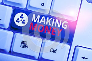 Text sign showing Making Money. Conceptual photo Giving the opportunity to make a profit Earn financial support White pc keyboard