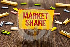 Text sign showing Market Share. Conceptual photo The portion of a market controlled by a particular company Clothespin holding yel