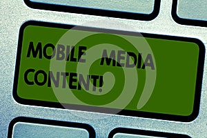 Text sign showing Mobile Media Content. Conceptual photo electronic media which is viewed on mobile phones Keyboard key