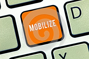 Text sign showing Mobilize. Conceptual photo make something movable or capable of movement prepare deploy photo