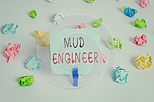 Text sign showing Mud Engineer. Conceptual photo liable for making mixture of fluids used in drilling process Colored crumpled photo