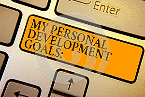 Text sign showing My Personal Development Goals. Conceptual photo Desires Wishes Career Business planning Keyboard orange key Inte