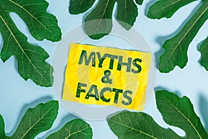 Text sign showing Myths And Facts. Conceptual photo usually traditional story of ostensibly historical events. photo