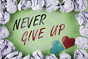 Text sign showing Never Give Up. Conceptual photo Be persistent motivate yourself succeed never look back written on plain green b photo