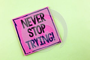 Text sign showing Never Stop Trying Motivational Call. Conceptual photo go on do not give up Self confidence written on Pink Stick