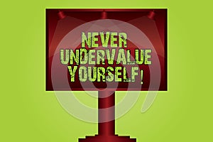 Text sign showing Never Undervalue Yourself. Conceptual photo Certainly not underestimate your real worth Blank Lamp Lighted Color