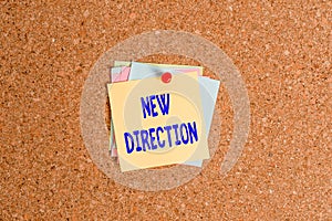 Text sign showing New Direction. Conceptual photo situation in which someone starts doing something totally new Corkboard color