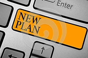 Text sign showing New Plan. Conceptual photo Start of a detailed proposal of doing or achieving something Keyboard orange key Inte
