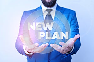 Text sign showing New Plan. Conceptual photo Start of a detailed proposal of doing or achieving something Man with