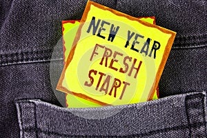 Text sign showing New Year Fresh Start. Conceptual photo Time to follow resolutions reach out dream job written on Yellow Sticky N