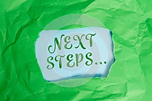 Text sign showing Next Steps. Conceptual photo something you do after you have finished doing first one Green crumpled